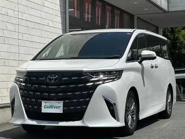 トヨタ アルファード Z 埼玉県 2024(令6)年 0.7万km プラチナホワイトパールマイカ ワンオーナー/トヨタ純正14インチコネクティッドナビ/フルセグ/BT/Miracast/HDMI/AM/FM/パノラミックビューモニター/左右独立ムーンルーフ/ユニバーサルステップ/13インチ有機EL後席モニター/デジタルインナーミラー/AC100V/置くだけ充電/ビルトインETC2.0/前後ドライブレコーダー/両側パワースライドドア/パワーバックドア/PCS/RSA/LDA/ACC/PKSB/BSM/RCTA/LEDオートライト/フォグランプ/オートハイビーム/ウッドコンビステアリング/ステアリングスイッチ/ステアリングヒーター/エア-シート/シートヒーター/メモリ付きパワーシート/nanoe/純正フロアマット/スマートキー/プッシュスタート