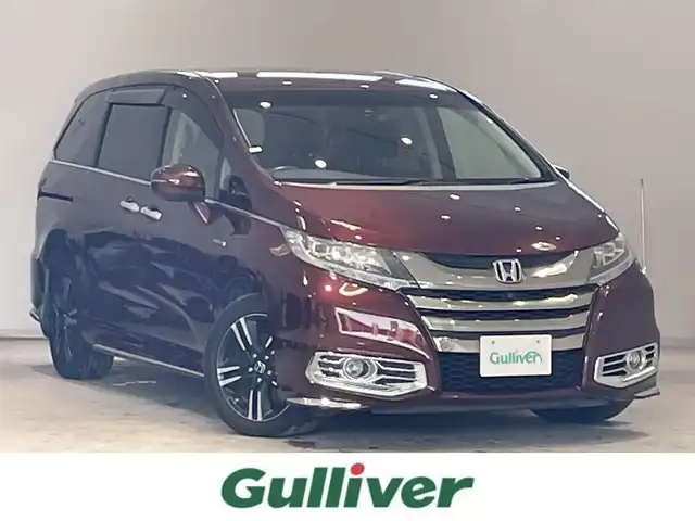 ホンダ オデッセイ ハイブリッド 宮城県 2016(平28)年 8.7万km プレミアムディープロッソパール ホンダセンシング/・横滑り防止/・レーンキープアシスト/・衝撃軽減ブレーキ/・クルーズコントロール/純正ナビ/・アラウンドビューモニター/・ドライブレコーダー/・フルセグTV/CD/DVD/・ETC/フリップダウンモニター/両側パワースライドドア/・パワーシート（運転席）/プッシュスタート/・スマートキー/LEDヘッドライト/・オートライト/・フォグランプ/革巻きステアリング/純正フロアマット/純正アルミホイール/ドアバイザー