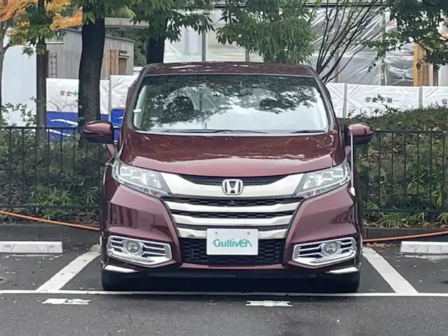 ホンダ オデッセイ ハイブリッド 宮城県 2016(平28)年 8.7万km プレミアムディープロッソパール ホンダセンシング/・横滑り防止/・レーンキープアシスト/・衝撃軽減ブレーキ/・クルーズコントロール/純正ナビ/・アラウンドビューモニター/・ドライブレコーダー/・フルセグTV/CD/DVD/・ETC/フリップダウンモニター/両側パワースライドドア/・パワーシート（運転席）/プッシュスタート/・スマートキー/LEDヘッドライト/・オートライト/・フォグランプ/革巻きステアリング/純正フロアマット/純正アルミホイール/ドアバイザー