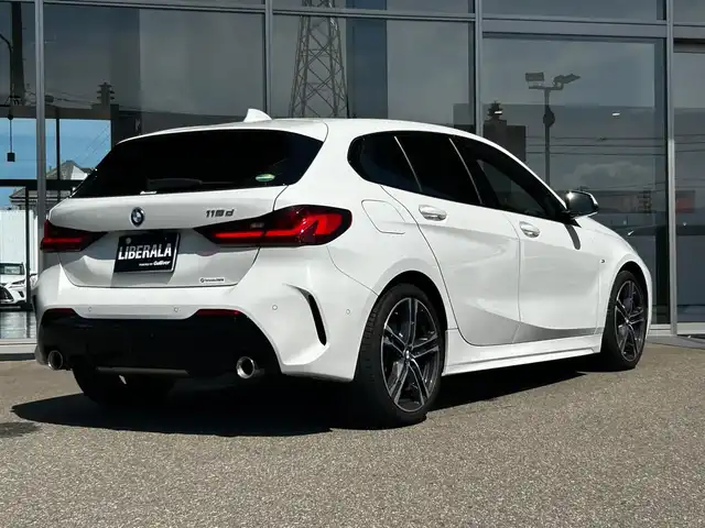 ＢＭＷ １１８ｄ Mスポーツ EDジョイ+ 富山県 2020(令2)年 1.4万km 白 HDDナビ/Bluetooth接続/AM/FMラジオ/App-conect/MirrorLink/バックカメラ/D席メモリ付きパワーシート/アイドリングストップ/パワーバックドア/純正前後ドラレコ/ACC/ETC/ワイヤレス充電/プッシュスタート/アドブルー/パークアシスト/横滑り防止/コーナーセンサー/純正18インチAW