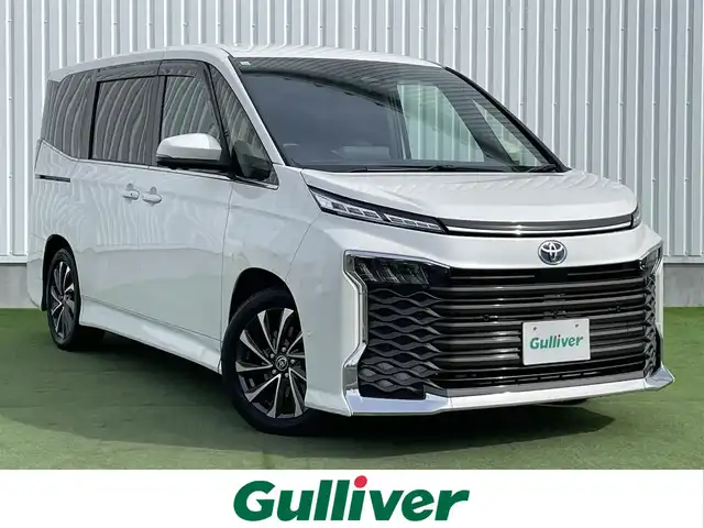 トヨタ ヴォクシー ハイブリッド S－Z 香川県 2023(令5)年 4.1万km ホワイトパールクリスタルシャイン 純正10.5インチディスプレイオーディオ/→ナビゲーションシステム/→CD/DVD再生/→HDMI接続/パノラミックビューモニター/レーダークルーズコントロール/ブラインドスポットモニター/ヘッドアップディスプレイ/デジタルインナーミラー/ビルトインETC/シートヒーター/ハーフレザーシート/両側パワースライドドア/キャプテンシート/トヨタセーフティセンス/クリアランスソナー/LEDオートライト/オートハイビーム/プッシュスタート/スマートキー