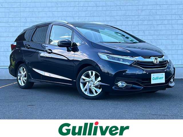 ホンダ シャトル ハイブリッド Z 茨城県 2017(平29)年 1.5万km ミッドナイトブルービームM ワンオーナー/純正ディーラーナビ/　　【ワンセグ、BT、CD、DVD】/バックカメラ/あんしんパッケージ/コンフォートビューパッケージ/前後コーナーセンサー/ハーフレザーシート/純正16インチAW/LEDオートライト/純正フロアマット/プッシュスタート/スマートキー/ETC/本革巻ステアリング/LED室内灯/プラズマクラスター付きAC/スーパーUVカットフロントガラス/IRカットフロントウィンドウ、ドアガラス/ステンレス製スポーツペダル/パドルシフト/前後シートヒーター