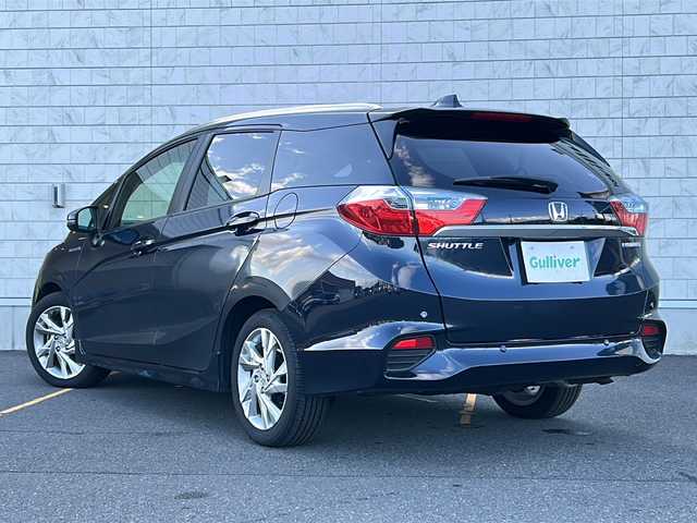 ホンダ シャトル ハイブリッド Z 茨城県 2017(平29)年 1.5万km ミッドナイトブルービームM ワンオーナー/純正ディーラーナビ/　　【ワンセグ、BT、CD、DVD】/バックカメラ/あんしんパッケージ/コンフォートビューパッケージ/前後コーナーセンサー/ハーフレザーシート/純正16インチAW/LEDオートライト/純正フロアマット/プッシュスタート/スマートキー/ETC/本革巻ステアリング/LED室内灯/プラズマクラスター付きAC/スーパーUVカットフロントガラス/IRカットフロントウィンドウ、ドアガラス/ステンレス製スポーツペダル/パドルシフト/前後シートヒーター