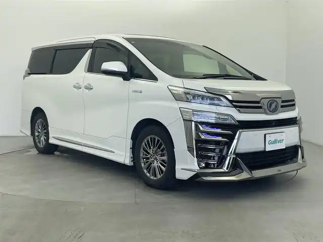 トヨタ ヴェルファイア ハイブリット エグゼクティブ ラウンジ Z 富山県 2018(平30)年 11.8万km ホワイトパールクリスタルシャイン JBLサウンド/サンルーフ/モデリスタエアロ/純正ナビ（AM/FM/DVD/BT/USB/フルセグ）/全方位カメラ/後席モニター/ブラインドスポットモニター/レザーシート/シートヒーター/エアシート/パワーシート/D席メモリシート/ハンドルヒーター/衝突被害軽減システム/レーダークルーズコントロール/レーンキープアシスト/コーナーセンサー/横滑り防止装置/オートLEDライト/オートマチックハイビーム/純正アルミホイール/純正フロアマット
