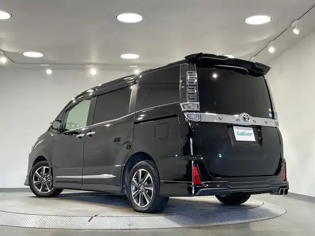 トヨタ ヴォクシー ZS 煌Ⅱ 愛知県 2019(令1)年 5.6万km ブラック アルパインＢＩＧＸ１１インチナビ/モデリスタエアロ/両側パワースライドドア/衝突軽減ブレーキ/車線逸脱警報/クリアランスソナー/先行車発進告知/オートハイビーム/クルーズコントロール/バックカメラ/ビルトインＥＴＣ/USB＆HDMI入力端子/ＬＥＤヘッドライト/アイドリングストップ/シートカバー/エムズスピードフロアマット/純正16インチアルミホイール
