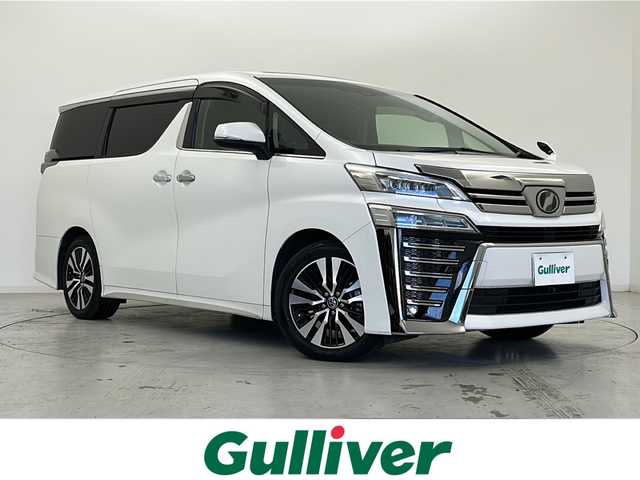 トヨタ ヴェルファイア Z Gエディション 宮城県 2018(平30)年 6.9万km ホワイトパールクリスタルシャイン 禁煙車/ツインムーンルーフ/純正フリップダウンモニター/両側パワースライドドア/レザーシート/トヨタセーフティセンス/・プリクラッシュセーフティ/・レーントレーシングアシスト/・レーダークルーズコントロール/・オートハイビーム/・ロードサインアシスト/純正10型ナビ/・CD・DVD・BT・SD・HDMI/フルセグTV/バックカメラ/前席パワーシート/前席シートヒーター/前席エアーシート/D席シートメモリー/革巻きステアリング/ステアリングスイッチ/パワーバックドア/電動パーキングブレーキ/AUTOHOLD/純正ドライブレコーダー（フロント）/LEDヘッドライト/LEDフォグライト/純正フロアマット/純正ドアバイザー/純正18インチアルミホイール/プッシュスタート/スマートキー×2/横滑り防止装置/ビルドインETC2.0/ロールサンシェード
