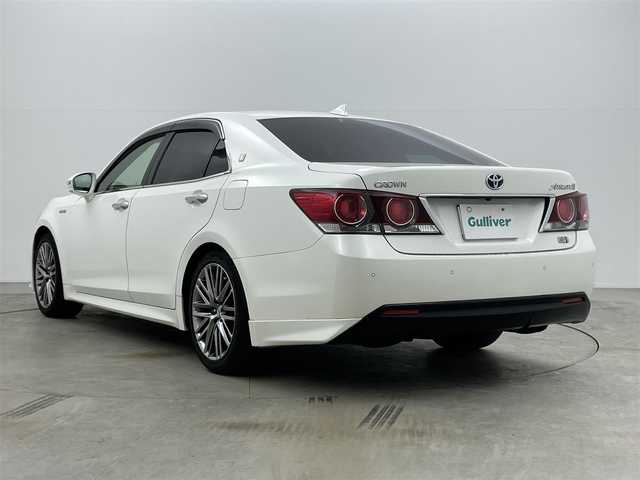 トヨタ クラウン ハイブリッド アスリートG 岡山県 2016(平28)年 14.3万km ホワイトパールクリスタルシャイン サンルーフ/純正ナビ/【Bluetooth/CD/DVD/フルセグTV】/黒合皮シート/前席シートヒーター/前席エアシート/前席パワーシート/シートメモリー機能/ステアリングヒーター/LEDヘッドライト/レーダークルーズコントロール/ビルトインETC/ブラインドスポットモニター/ステアリングリモコン/純正ドライブレコーダー（前）/オートライト/ハイビーム/電動ステアリング調整/純正フロアマット/バイザー/バックカメラ/エアコンスイング機能/プッシュスタート/スマートキー