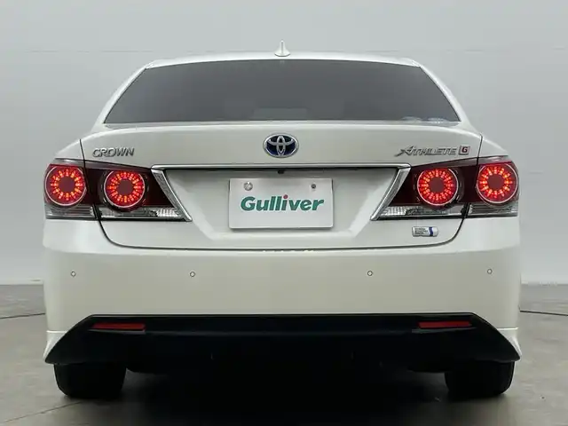 トヨタ クラウン ハイブリッド アスリートG 岡山県 2016(平28)年 14.3万km ホワイトパールクリスタルシャイン サンルーフ/純正ナビ/【Bluetooth/CD/DVD/フルセグTV】/黒合皮シート/前席シートヒーター/前席エアシート/前席パワーシート/シートメモリー機能/ステアリングヒーター/LEDヘッドライト/レーダークルーズコントロール/ビルトインETC/ブラインドスポットモニター/ステアリングリモコン/純正ドライブレコーダー（前）/オートライト/ハイビーム/電動ステアリング調整/純正フロアマット/バイザー/バックカメラ/エアコンスイング機能/プッシュスタート/スマートキー