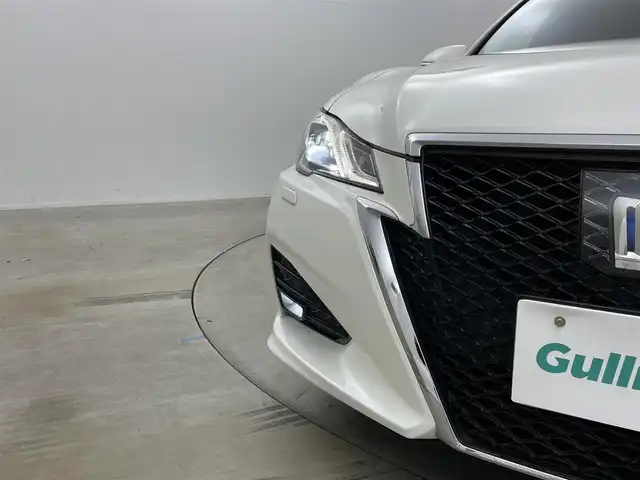 トヨタ クラウン ハイブリッド アスリートG 岡山県 2016(平28)年 14.3万km ホワイトパールクリスタルシャイン サンルーフ/純正ナビ/【Bluetooth/CD/DVD/フルセグTV】/黒合皮シート/前席シートヒーター/前席エアシート/前席パワーシート/シートメモリー機能/ステアリングヒーター/LEDヘッドライト/レーダークルーズコントロール/ビルトインETC/ブラインドスポットモニター/ステアリングリモコン/純正ドライブレコーダー（前）/オートライト/ハイビーム/電動ステアリング調整/純正フロアマット/バイザー/バックカメラ/エアコンスイング機能/プッシュスタート/スマートキー