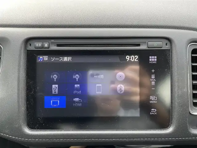 ホンダ ヴェゼル ハイブリッド Z 三重県 2015(平27)年 7.9万km ホワイトオーキッドパール 登録時78211km/禁煙車/ワンオーナー/ハーフレザーシート/ルーフレール/純正ナビ/（AM/FM/TV/Bluetooth/HDMI）/ワンセグTV/バックカメラ/ビルトインETC/ステアリングスイッチ/パドルシフト/クルーズコントロール/オートライト/スペアキー/プッシュスタート