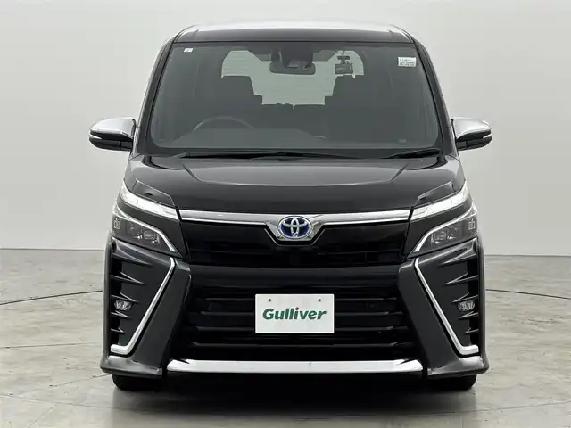 トヨタ ヴォクシー ハイブリッド ZS 煌Ⅲ 福岡県 2021(令3)年 5.5万km イナズマスパーキングブラックガラスフレーク 純正ナビ／フルセグＴＶ　/バックカメラ　/クルーズコントロール　/コーナーセンサー　/衝突軽減ブレーキ　/レーンキープ　/アクセル踏み間違い防止　/両側電動スライドドア　/ハーフレザーシート　/シートヒーター　/ＬＥＤヘッドライト