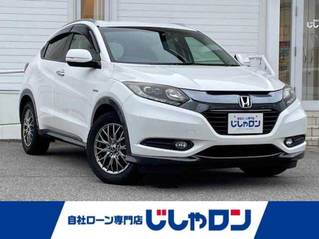 ホンダ ヴェゼル ハイブリッド X 富山県 2014(平26)年 10.9万km ホワイトオーキッドパール (株)IDOMが運営する【じしゃロン富山店】の自社ローン専用車両になります。こちらは現金またはオートローンご利用時の価格です。自社ローンご希望の方は別途その旨お申し付け下さい/ルーフレール/純正インターナビ/FM/AM/CD/TV/USB/HDMI/Bluetooth/シティブレーキアクティブシステム（衝突軽減）/バックカメラ/ビルトインETC/前方ドライブレコーダー/横滑り防止装置/クルーズコントロール/リアクティブフォースペダル（RFP）/スタッドレスタイヤ（サマータイヤ積み込み）/LEDヘッドライト/オートライト/フォグランプ/電子パーキング/ステアリングリモコン/プッシュスタート/スマートキー/スペアキー1本