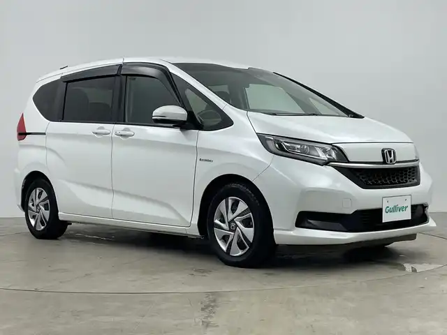 ホンダ フリード ハイブリット G ホンダセンシング 鹿児島県 2021(令3)年 3.3万km プラチナホワイトパール 純正ナビ/（CD/BT）/両側パワースライドドア/ホンダセンシング/バックカメラ/オートクルーズコントロール/LEDヘッドライト/シートヒーター/ロールサンシェイド/オートリトラミラー/スマートキー/ETC/オートライト