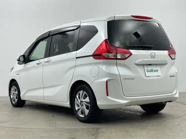 ホンダ フリード ハイブリット G ホンダセンシング 鹿児島県 2021(令3)年 3.3万km プラチナホワイトパール 純正ナビ/（CD/BT）/両側パワースライドドア/ホンダセンシング/バックカメラ/オートクルーズコントロール/LEDヘッドライト/シートヒーター/ロールサンシェイド/オートリトラミラー/スマートキー/ETC/オートライト