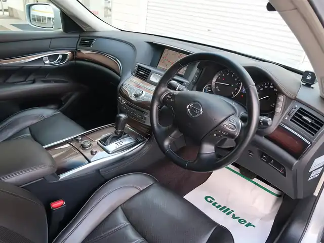 日産 フーガ ハイブリッド VIPパッケージ 石川県 2011(平23)年 15.7万km エターナルスノーホワイト バイキセノンライト/Fフォグライト/Fパワーシート/Fシートエアコン/ESC/フルセグTV/リアカメラ/Pスタート/ハンドルスイッチ/クルコン/オートライト/ビルトインETC/リアローラーブラインド/ドアバイザー/純正フロアマット/助手席オットマン