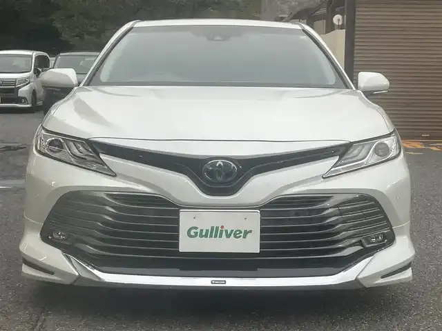 トヨタ カムリ G レザーパッケージ 千葉県 2018(平30)年 9.9万km プラチナホワイトパールマイカ モデリスタエアロ（フロント・サイド・リア）/純正ナビ【フルセグ、BT、CD、USB、AUX、SD】/純正18インチアルミホイール/プリクラッシュセーフティ/パーキングアシスト/ブラインドスポットモニター/リヤクロストラフィックアラート/インテリジェントクリアランスソナー/ヘッドアップディスプレイ/ビルトインETC2.0/クルーズコントロール/MT付AT/オートライト/オートハイビーム/前席パワーシート/前席シートヒーター/電動パーキングブレーキ/前ドラレコ（DRY-ST3000）/デュアルエアコン/フルオートPW/純正フロアマット/ドアバイザー