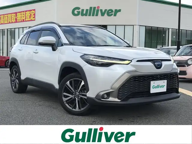 トヨタ カローラ クロス ハイブリッド Z 鳥取県 2021(令3)年 5.5万km プラチナホワイトパールマイカ ４・W・D/ワンオーナー/純正ディスプレイオーディオ/ナビ/BT/USB/Miracast/パノラミックビューモニター/パノラマルーフ/トヨタセーフティセンス/レーンキープアシスト/レーダークルーズコントロール/クリアランスソナー/ブラインドスポットモニター/ビルトインETC/純正ドライブレコーダー（前方）/電動リアゲート/ハーフレザーシート/運転席パワーシート/前席シートヒーター/LEDヘットライト/フォグライト/純正18インチアルミホイール/プッシュエンジンスタート/スマートキー/スタットレスセット積込/（タイヤ溝7部山）