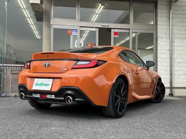 トヨタ ＧＲ８６ RZ 10thアニバーサリーLTD 埼玉県 2023(令5)年 0.3万km フレイムオレンジ ワンオーナー/社外9インチメモリーナビ/CD/DVD/SD/BT/USB/フルセグTV/GRパフォーマンスダンパー/純正18インチAW/クルーズコントロール/ハーフレザーシート/シートヒーター/ステアリングリモコン/バックカメラ/USB充電ポート/オートライト/LEDヘッドライト/リアフォグライト/プッシュスタート/フロアマット