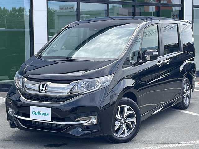 ホンダ ステップワゴン スパーダ クルスピセンシング 道東・釧路十勝 2017(平29)年 1.1万km プレミアムスパークルブラックパール ・4WD/・純正SDメモリナビ/ (CD/DVD/フルセグTV/Bluetooth/USB/MSV)/・バックカメラ/・ビルトインETC/・両側パワースライドドア/・前方ドライブレコーダー/・ハーフレザーシート/・前席シートヒーター/・HONDA SENSING/・アダプティブクルーズコントロール（ACC）/・衝突軽減ブレーキ（CMBS）/・車線維持支援システム（LKAS）/・誤発進抑制機能/・先行車発進お知らせ機能/・標識認識機能/・横滑り防止機能/・純正16インチアルミホイール/・スマートキー/・オートライト/・純正LEDヘッドライト/・パドルシフト/・カーテンエアバック/・保証書/・取扱説明書