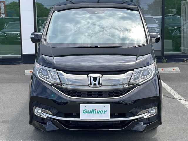 ホンダ ステップワゴン スパーダ クルスピセンシング 長野県 2017(平29)年 1.1万km プレミアムスパークルブラックパール ・4WD/・純正SDメモリナビ/ (CD/DVD/フルセグTV/Bluetooth/USB/MSV)/・バックカメラ/・ビルトインETC/・両側パワースライドドア/・前方ドライブレコーダー/・ハーフレザーシート/・前席シートヒーター/・HONDA SENSING/・アダプティブクルーズコントロール（ACC）/・衝突軽減ブレーキ（CMBS）/・車線維持支援システム（LKAS）/・誤発進抑制機能/・先行車発進お知らせ機能/・標識認識機能/・横滑り防止機能/・純正16インチアルミホイール/・スマートキー/・オートライト/・純正LEDヘッドライト/・パドルシフト/・カーテンエアバック/・保証書/・取扱説明書
