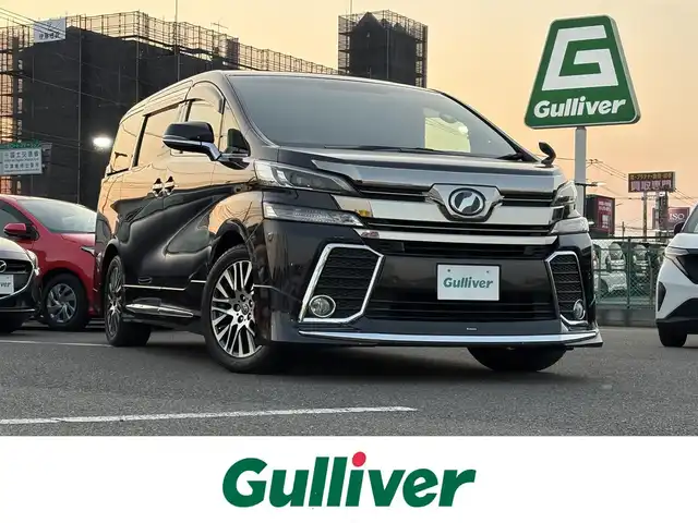 トヨタ ヴェルファイア Z Gエディション 大分県 2015(平27)年 7.1万km スパークリングブラックパールクリスタルシャイン ・純正ナビ(CD/DVD/BT/SD)/・フルセグテレビ/・バックモニター/・フリップダウンモニター/・モデリスタ/・サンルーフ/・両側パワースライドドア/・衝突軽減ブレーキ/・コーナーセンサー/・レーダークルーズコントロール/・ドライブレコーダー/・ETC/・デジタルインナーミラー/・MTモード付きAT/・ステアリングヒーター/・ブレーキホールド/・パワーシート/・シートメモリー/・スマートキー/・プッシュスタートボタン/・純正アルミホイール
