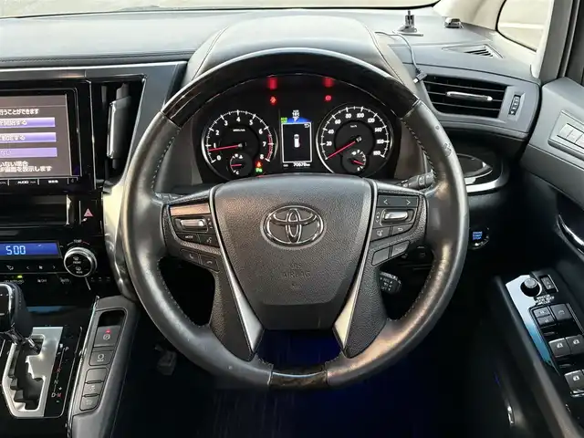 トヨタ ヴェルファイア Z Gエディション 大分県 2015(平27)年 7.1万km スパークリングブラックパールクリスタルシャイン ・純正ナビ(CD/DVD/BT/SD)/・フルセグテレビ/・バックモニター/・フリップダウンモニター/・モデリスタ/・サンルーフ/・両側パワースライドドア/・衝突軽減ブレーキ/・コーナーセンサー/・レーダークルーズコントロール/・ドライブレコーダー/・ETC/・デジタルインナーミラー/・MTモード付きAT/・ステアリングヒーター/・ブレーキホールド/・パワーシート/・シートメモリー/・スマートキー/・プッシュスタートボタン/・純正アルミホイール