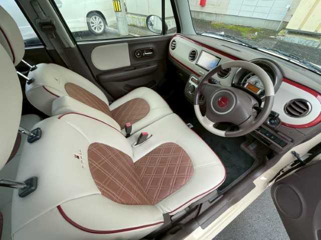 スズキ ラパン ショコラ X 岩手県 2014(平26)年 4.3万km ミルクティーベージュメタリック AIS検査済み/【2510037393】/社外SDナビ/電格ミラー/ABS/オートライト/レザーシート/純正フロアマット/アイドリングストップ/ビルトインETC