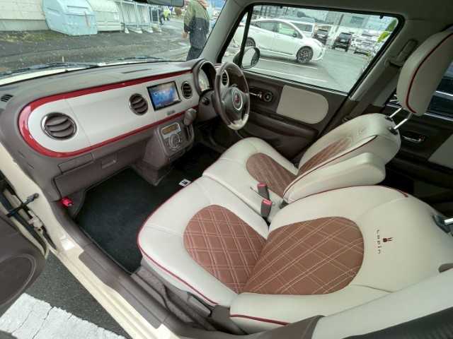 スズキ ラパン ショコラ X 岩手県 2014(平26)年 4.3万km ミルクティーベージュメタリック AIS検査済み/【2510037393】/社外SDナビ/電格ミラー/ABS/オートライト/レザーシート/純正フロアマット/アイドリングストップ/ビルトインETC