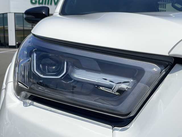 トヨタ ハイラックス Z GRスポーツ 青森県 2023(令5)年 0.9万km スーパーホワイトⅡ ・４ＷＤ/・ディーゼルターボ/・寒冷地仕様/・トヨタセーフティセンス/・レーンキープアシスト/・レーダークルーズコントロール/・純正メモリーナビ/　AM/FM/DVD/CD/BT/Miracast/・フルセグ/・全方位カメラ/・純正ＥＴＣ/・社外ドライブレコーダー/・ＳＭＡＲＴＴＯＰキャノピー/・ジャオスＢＡＴＴＬＥＺダンパー/・ジャオスリフトアップスプリング/・１８インチレイズ製ＴＥＡＭＤＡＹＴＯＮＡホイール装着/・フードモール/・サイドターンランプ付電動格納ドアミラー/・専用オーバーフェンダー/・専用エンブレム（フロント・サイド・リア）/・マッドフラップ/・パワーシート（運転席側）/・合皮シートカバー/・ワイパーデアイサー/・オートライト/・ＬＥＤフォグランプ/・ドアバイザー/・純正フロアマット（ゴムタイプ）/・スペアキー/・保証書/・取扱説明書/マフラー純正戻します