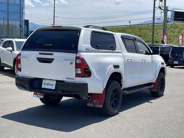 トヨタ ハイラックス Z GRスポーツ 青森県 2023(令5)年 0.9万km スーパーホワイトⅡ ・４ＷＤ/・ディーゼルターボ/・寒冷地仕様/・トヨタセーフティセンス/・レーンキープアシスト/・レーダークルーズコントロール/・純正メモリーナビ/　AM/FM/DVD/CD/BT/Miracast/・フルセグ/・全方位カメラ/・純正ＥＴＣ/・社外ドライブレコーダー/・ＳＭＡＲＴＴＯＰキャノピー/・ジャオスＢＡＴＴＬＥＺダンパー/・ジャオスリフトアップスプリング/・１８インチレイズ製ＴＥＡＭＤＡＹＴＯＮＡホイール装着/・フードモール/・サイドターンランプ付電動格納ドアミラー/・専用オーバーフェンダー/・専用エンブレム（フロント・サイド・リア）/・マッドフラップ/・パワーシート（運転席側）/・合皮シートカバー/・ワイパーデアイサー/・オートライト/・ＬＥＤフォグランプ/・ドアバイザー/・純正フロアマット（ゴムタイプ）/・スペアキー/・保証書/・取扱説明書/マフラー純正戻します