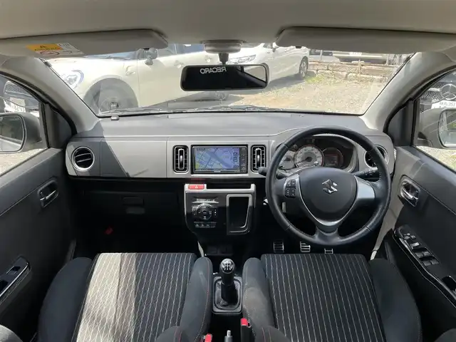 スズキ アルト ワークス 愛知県 2021(令3)年 0.8万km スチールシルバーM ワンオーナー/ターボ/5速MT/社外メモリナビ/（DVD/フルセグTV/Bluetooth/USB）/前席レカロセミバケットシート/横滑り防止機能/純正HIDヘッドライト/フォグランプ/純正15インチアルミホイール/スマートキー/保証書/取扱説明書