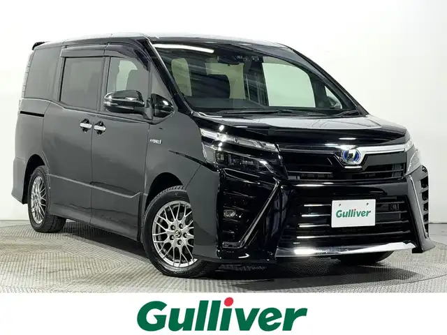 トヨタ ヴォクシー ハイブリッド ZS 煌Ⅱ 大阪府 2019(平31)年 2.2万km ブラック 純正10incナビTV バックカメラ シートヒーター クルーズコントロール 衝突軽減ブレーキ レーンアシスト オートハイビーム 両側パワースライドドア リアオートエアコン ドライブレコーダー ETC