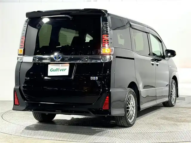 トヨタ ヴォクシー ハイブリッド ZS 煌Ⅱ 大阪府 2019(平31)年 2.2万km ブラック 純正10incナビTV バックカメラ シートヒーター クルーズコントロール 衝突軽減ブレーキ レーンアシスト オートハイビーム 両側パワースライドドア リアオートエアコン ドライブレコーダー ETC