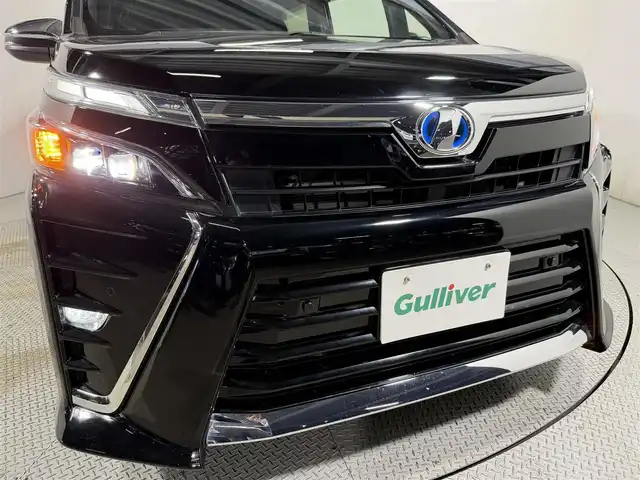 トヨタ ヴォクシー ハイブリッド ZS 煌Ⅱ 大阪府 2019(平31)年 2.2万km ブラック 純正10incナビTV バックカメラ シートヒーター クルーズコントロール 衝突軽減ブレーキ レーンアシスト オートハイビーム 両側パワースライドドア リアオートエアコン ドライブレコーダー ETC