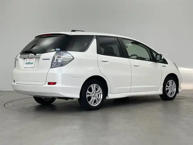 ホンダ フィット シャトル ハイブリッド スマートセレ 埼玉県 2013(平25)年 2万km プレミアムホワイトパール 純正ナビ　バックカメラ　地デジフルセグ　クルーズコントロール　キセノンヘッドライト　ハーフレザーシート　Ｂｌｕｅｔｏｏｔｈ　スマートキー　ＥＴＣ　ステアリングスイッチ　純正アルミホイール　オートライト