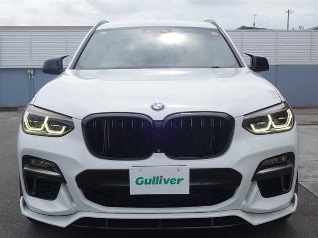 ＢＭＷ Ｘ３ xDrive20d Mスポーツ 静岡県 2018(平30)年 6.6万km アルピンホワイトⅢ 禁煙車/車検令和9年5月まで/2000CCディーゼルターボ/4WD/パーキングアシストプラス/ドライビングアシストプラス/　アクティブクルーズコントロール/　ステアリング/レーンコントロールアシスト/　レーンディパーチャー/　レーンチェンジウォーニング/　アクティブサイドコリジョン/　前車接近警告機能/　衝突回避・被害軽減ブレーキ/　クロストラフィック/アダプティブLEDヘッドライト/ブラックレザーシート/　前席シートヒーター・パワーシート/後席エアコン/社外Mフロントグリル/　フロントスポイラー/　ルーフスポイラー/　テールゲートスポイラー/　Mタイプミラーカバー/　シーケンシャルウインカーミター/　フロントヘッドライト・フォグ/　テールレンズブラッククリア済み/純正OP20インチAW/純正HDDナビ・DVD・CD・BT/　フルセグTV ＴＶキット/　全方位バックカメラ/多数コーディング/　アルピナメーター//　アイドルオフ/バック音ロールス/ユピテル360ど+リヤドライブレコーダー/社外ローダウサス/ワイドスペーサー/社外ワインカラーカーペット/ラゲージマット/カバー/純正スマートキー