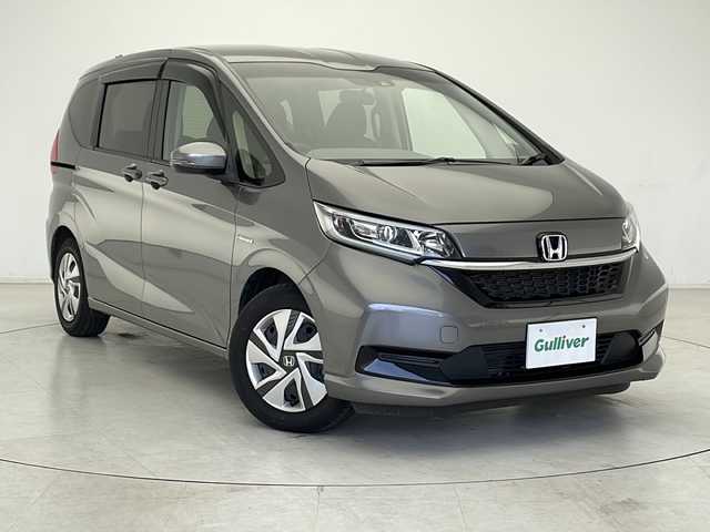 ホンダ フリード ハイブリット G ホンダセンシング 千葉県 2022(令4)年 2万km スーパープラチナグレーメタリック ワンオーナー/ホンダセンシング/純正ディーラーOPナビ/フルセグTV/Bluetooth/DVD再生/バックカメラ/クルーズコントロール/前席シートヒーター/前後ドライブレコーダー【HDR36GW】/ステアリングスイッチ/両側パワースライドドア/スペアキーX1/保証書/取扱説明書