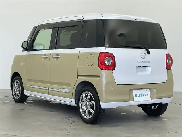 ダイハツ ムーヴ キャンバス ストライプス G 富山県 2022(令4)年 0.9万km シャイニングホワイトパール/サンドベージュメタリック 社外ナビ（AM/FM/DVD/BT/フルセグ）/バックカメラ/両側パワースライドドア/シートヒーター/衝突被害軽減システム/コーナーセンサー/横滑り防止装置/アイドリングストップ/オートLEDライト/フォグライト/社外アルミホイール/純正フロアマット/オートホールド付電子パーキング/ステアリングスイッチ/スマートキー/スペアキー