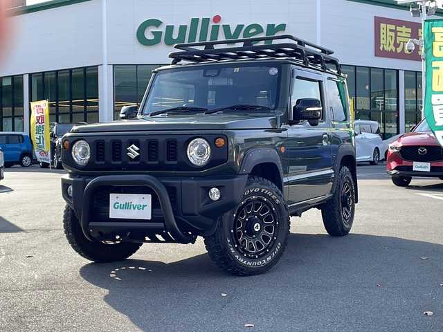 スズキ ジムニー XC 長野県 2023(令5)年 3.5万km ジャングルグリーン 禁煙車/フロントグリルガード/キャリア/ハシゴ/社外8インチメモリナビ/【AVIC-RL812】/（CD/DVD/フルセグTV/Bluetooth）/社外デジタルインナーミラー型前後ドライブレコーダー/マッガード/オーバーフェンダー/セーフティーサポート/・デュアルセンサーブレーキサポート/・車線逸脱警報機能/・ハイビームアシスト/社外１６インチアルミホイール/バックカメラ/ビルトインETC/シートヒーター/革巻きステアリング/クルーズコントロール/ステアリングスイッチ/LEDヘッドライト/フォグランプ/オートライト/スマートキー/プッシュスタート/電動格納ミラー/ヘッドライトウォッシャー/ダウンヒルアシストコントロール/純正ゴムフロアマット/背面タイヤ