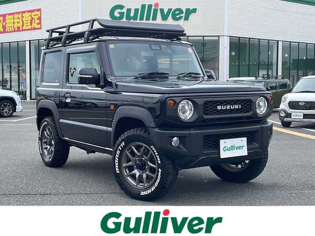 スズキ ジムニー XC 鳥取県 2020(令2)年 3.8万km ブルーイッシュブラックパール3 ４WD・ターボ/ワンオーナー/社外ディスプレイオーディオ/BT/USB/バックカメラ/前後ドライブレコーダー/前席シートヒーター/レーダーブレーキサポート/レーンキープアシスト/クルーズコントロール/LEDヘットライト/純正16インチアルミホイール/ブロックタイヤ/ルーフラック/SUZUKIフロントグリル/オーバーフェンダー/レザー調シートカバー/プッシュエンジンスタート/フロアマット/スタットレスセット積み込/（タイヤ溝6-7部山）