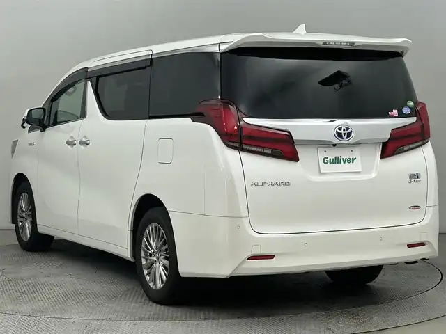 トヨタ アルファードハイブリット G 道央・札幌 2018(平30)年 6.5万km ホワイトパールクリスタルシャイン ・４ＷＤ/・フリップダウン/・純正ナビ/・BT/CD/DVD/SD/・フルセグTV/・トヨタセーフティセンス/・ビルトインETC2.0/・MTモード/・パワーシート/・両側パワースライドドア/・シートヒーター／エアコン/・純正ドライブレコーダー/・アダプティブクルーズコントロール/・ステアリングスイッチ/・電子パーキングブレーキ/・オートホールド/・オートライト/・オートマチックハイビーム/・純正フロアマット/・スマートキー/・プッシュスタート/・ホワイトレザーシート