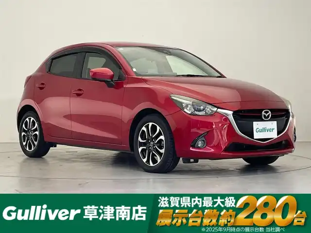 マツダ デミオ XD ツーリング 滋賀県 2014(平26)年 7万km ソウルレッドプレミアムメタリック 純正ナビ/Bluetooth/USB/クルーズコントロール/LEDヘッドライト/オートライト/ETC/パドルシフト/ヘッドアップディスプレイ/純正フロアマット/ドアバイザー/プッシュスタート/スマートキー/ステアリングリモコン