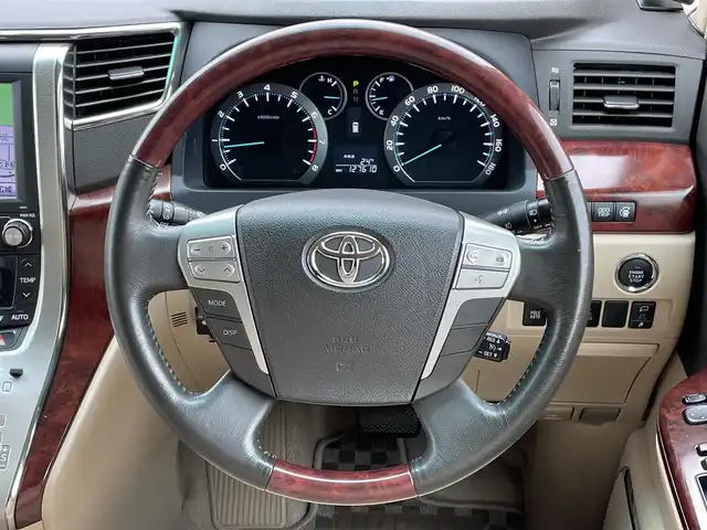 トヨタ ヴェルファイア 3．5Z Gエディション 道央・札幌 2008(平20)年 12.8万km ボルドーマイカメタリック ４WD/純正ディーラーOPナビ/CD/DVD/MD/フルセグ/純正フリップダウンモニター/横滑り防止装置/クルーズコントロール/パーキングセンサー/クリアランスソナー/AFS/センターデフロック/バック/サイド/フロントカメラ/ビルトインETC/両側パワースライドドア/パワーバックドア/前席/２列目パワーシート/D席メモリーシート/N席/２列目オットマン/革巻きウッドコンビステアリング/ステアリングリモコン/AC100V/POLEAUTO/MTモード付AT/レーダー探知機/プッシュスタート/スマートキー/HIDヘッドライト/オートライト/フォグランプ/電動格納ミラー/ウィンカーミラー/フロアマット/ドアバイザー