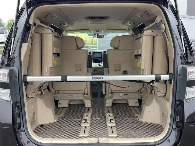 トヨタ ヴェルファイア 3．5Z Gエディション 道央・札幌 2008(平20)年 12.8万km ボルドーマイカメタリック ４WD/純正ディーラーOPナビ/CD/DVD/MD/フルセグ/純正フリップダウンモニター/横滑り防止装置/クルーズコントロール/パーキングセンサー/クリアランスソナー/AFS/センターデフロック/バック/サイド/フロントカメラ/ビルトインETC/両側パワースライドドア/パワーバックドア/前席/２列目パワーシート/D席メモリーシート/N席/２列目オットマン/革巻きウッドコンビステアリング/ステアリングリモコン/AC100V/POLEAUTO/MTモード付AT/レーダー探知機/プッシュスタート/スマートキー/HIDヘッドライト/オートライト/フォグランプ/電動格納ミラー/ウィンカーミラー/フロアマット/ドアバイザー