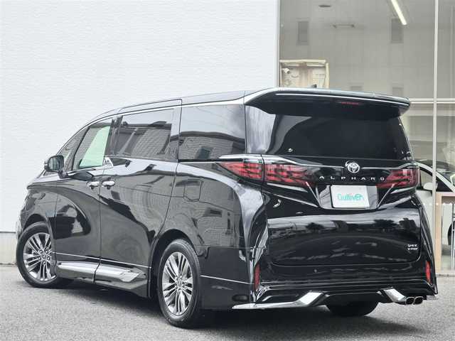 トヨタ アルファードハイブリット Z 愛知県 2024(令6)年 1.4万km ブラック /禁煙車/4WD//純正14インチディスプレイオーディオ【ナビキッドあり】/フルセグ・Bluetooth・USB・Miracast・FM・AM・交通情報//13.2型有機EL後席ディスプレイ【V13T-R72F】//パノラミックビューモニター/バックカメラ//両側パワースライドドア//モデリスタエアロ【フロント・サイド・リアアンダー】//左右独立ムーンルーフ//電動サイドシェード//前席パワーシート/メモリシート//1.2列目シートヒーター/エアシート//パワーバックドア//デジタルインナーミラー//AC100V//Toyota Safety Sense/プリクラッシュセーフティ/レーダークルーズコントロール/レーンディパーチャーアラート/レーンチェンジアラート/ロードサインアシスト/フロントクロストラフィックアラート/オートマチックハイビーム//トヨタチームメイト/アドバンストドライブ/アドバンストパーキング/ブラインドスポッドモニター/安心降車アシスト//三眼LEDオートライト//純正18インチアルミホイール//電子パーキングブレーキ//ブレーキホールド//置くだけ充電//モデリスタマフラー//プッシュスタート//ドラレコ【Y-3100】//ビルトインETC 2.0//スペアキー1本//新車保証書