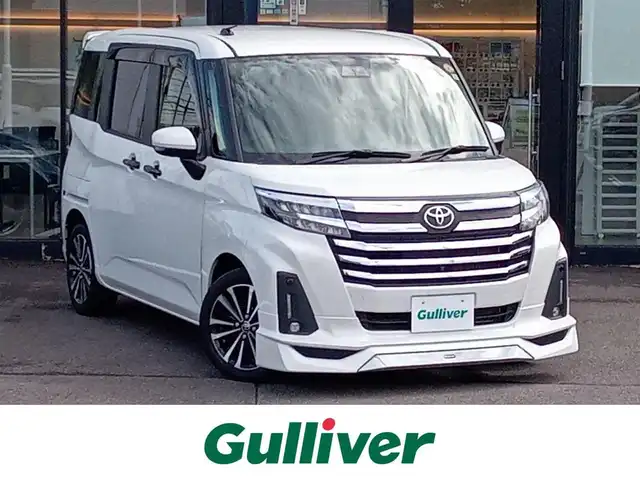 トヨタ ルーミー カスタムG－T 福井県 2023(令5)年 2.6万km パールホワイトⅢ モデリスタフロントエアロ/純正15インチAW/全方位カメラ/両側パワースライドドア/革調シートカバー/全車速追従機能付クルーズコントロール/前後コーナーセンサー/パイオニア9インチメモリナビ/フルセグテレビ/サンシェード/LEDヘッドライト/Fフォグ/オートホールド/本革巻きステアリング/スマートキー
