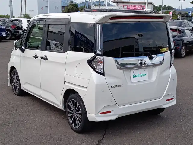 トヨタ ルーミー カスタムG－T 福井県 2023(令5)年 2.6万km パールホワイトⅢ モデリスタフロントエアロ/純正15インチAW/全方位カメラ/両側パワースライドドア/革調シートカバー/全車速追従機能付クルーズコントロール/前後コーナーセンサー/パイオニア9インチメモリナビ/フルセグテレビ/サンシェード/LEDヘッドライト/Fフォグ/オートホールド/本革巻きステアリング/スマートキー