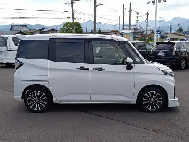 トヨタ ルーミー カスタムG－T 福井県 2023(令5)年 2.6万km パールホワイトⅢ モデリスタフロントエアロ/純正15インチAW/全方位カメラ/両側パワースライドドア/革調シートカバー/全車速追従機能付クルーズコントロール/前後コーナーセンサー/パイオニア9インチメモリナビ/フルセグテレビ/サンシェード/LEDヘッドライト/Fフォグ/オートホールド/本革巻きステアリング/スマートキー
