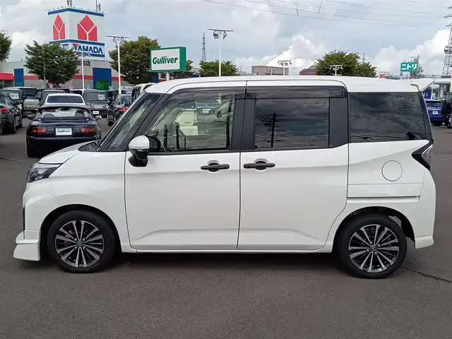 トヨタ ルーミー カスタムG－T 福井県 2023(令5)年 2.6万km パールホワイトⅢ モデリスタフロントエアロ/純正15インチAW/全方位カメラ/両側パワースライドドア/革調シートカバー/全車速追従機能付クルーズコントロール/前後コーナーセンサー/パイオニア9インチメモリナビ/フルセグテレビ/サンシェード/LEDヘッドライト/Fフォグ/オートホールド/本革巻きステアリング/スマートキー