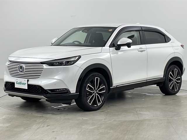 ホンダ ヴェゼル ハイブリッド e:HEV Z 道央・札幌 2023(令5)年 2万km プラチナホワイトパール ・4WD/・寒冷地仕様/・純正ナビ/&BT&USB&フルセグTV&スマートフォン連携/・パワーバックドア/・バックカメラ/・ホンダセンシング/・レーダークルーズコントロール/・前席シートヒーター/・ステアリングヒーター/・ドアミラーヒーター/・純正ドライブレコーダー/・置くだけ充電/・ビルトインETC2.0/・パドルシフト/・純正フロアマット/・LEDヘッドライト/・オートライト/・スマートキー/・スペアキー/・社外AW冬タイヤ積込/・保証書/・取扱説明書